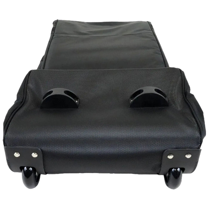 A black wheeled luggage case lies flat with handles on top and smooth wheels underneath showcasing a textured surface designed for easy mobility and transport often used for travel or storage
