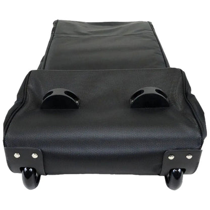 A black wheeled luggage case lies flat with handles on top and smooth wheels underneath showcasing a textured surface designed for easy mobility and transport often used for travel or storage