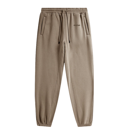 Brown sweatpants with a brand logo on a white background