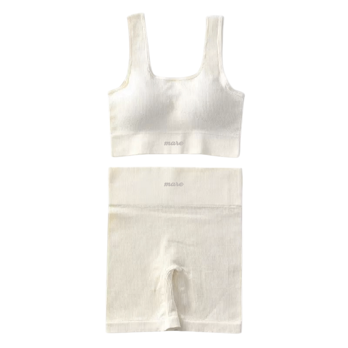 White ribbed tank top and shorts set on a white background
