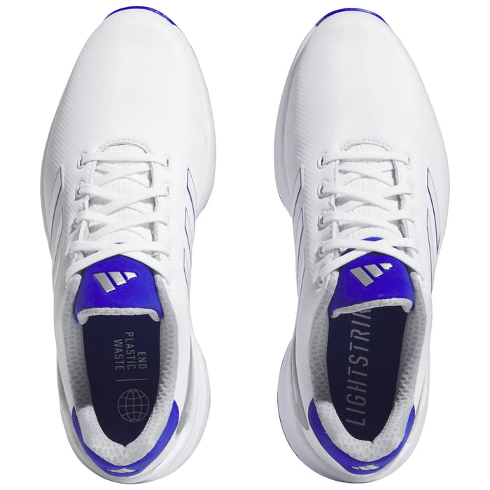 White athletic shoes with purple accents are positioned side by side laced tightly showcasing their design The shoes are set against a neutral background emphasizing their features and colors