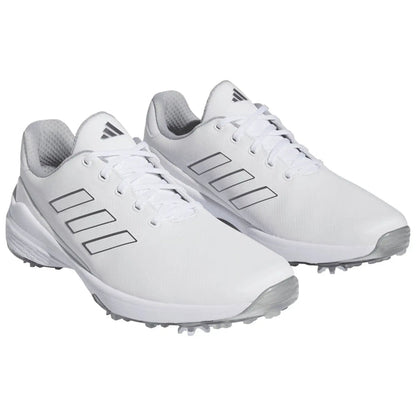 White athletic shoes are positioned side by side showcasing their sleek design and contrasting grey accents made for sports use in various outdoor environments