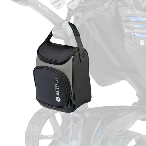 A black and gray golf accessory bag hangs from the handle of a golf trolley organized for carrying items conveniently while playing golf on a course.