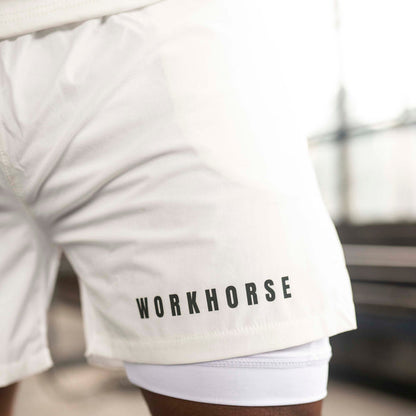 Model wearing Workhorse's Power Sport Shorts in white.