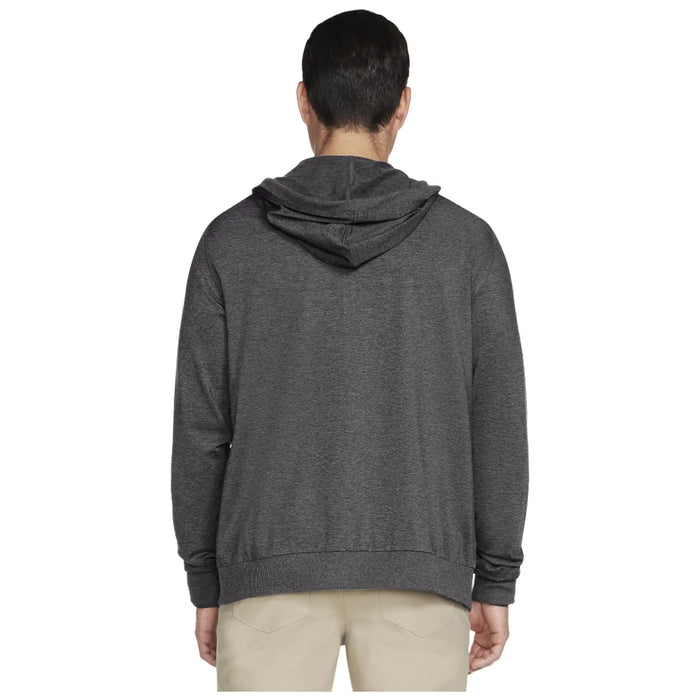 A person is facing away wearing a dark gray hooded sweatshirt with a kangaroo pocket and beige pants in a neutral background likely representing a clothing advertisement or catalog setting.