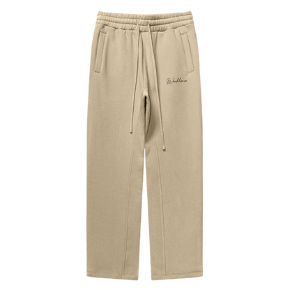 Sand sweatpants with a brand logo on a white background