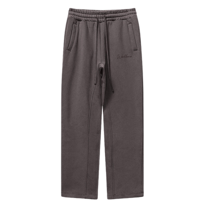 Plum sweatpants with a drawstring on a white background